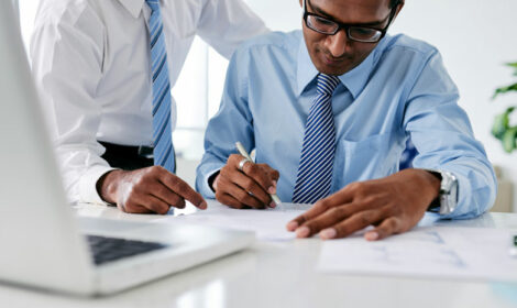 A businessman signing a contract