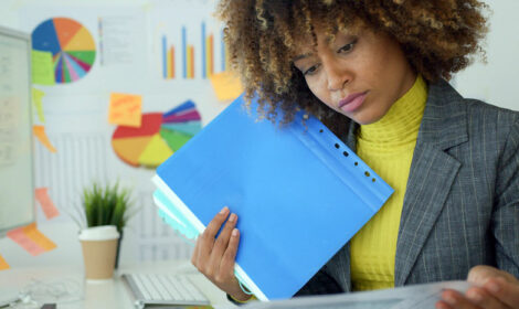 A female budget analyst reviewing charts